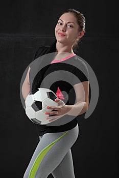 Sexy girl with soccer ball