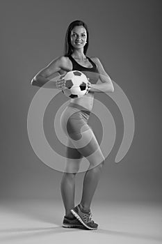 Sexy girl with soccer ball