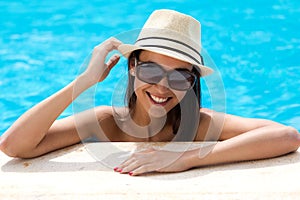 girl standing in swimming pool.