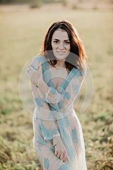 Sexy girl in underwear topless in the field in the summer