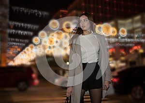 Sexy gorgeous brunette girl portrait in night city lights. Vogue fashion style portrait of young pretty beautiful woman