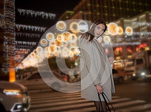 Sexy gorgeous brunette girl portrait in night city lights. Vogue fashion style portrait of young pretty beautiful woman