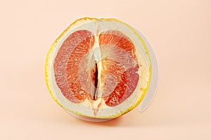 Sexy grapefruit, erotic concept. Sectional grapefruit is a symbol of the vagina and clitoris. Erotic half of grapefruit in a