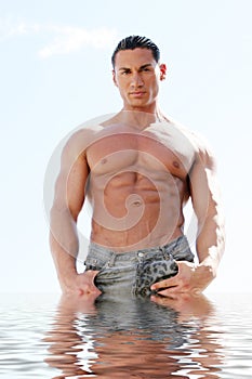 handsome athletic man in water