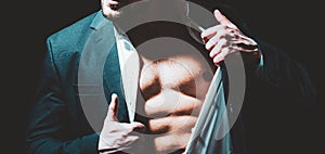 Sexy male body torso in suit. Business man undress suit on black background. photo