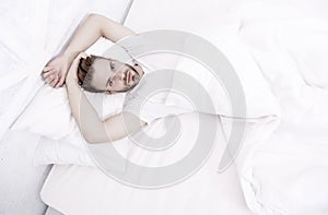 sexy man in bed. early morning wakeup. lazy sunday with morning sex. man lying white bedroom. time to relax. male health