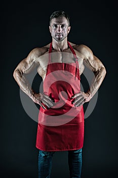 Sexy man cook. man with muscular torso in chef apron. cuisine. male housewife. husband in kitchen. brutal butcher. food