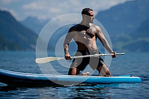 Sexy man paddling on paddleboard. Healthy summer lifestyle. Summer sport. SUP surfing tour in adventure summer vacation