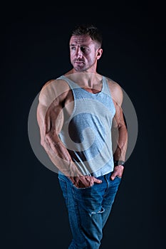 Sexy man in vest. muscular body man. denim style. summer male fashion. perfect body muscles, biceps and triceps. strong