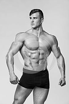 muscular man fitness model in underwear. Strong male naked torso abs