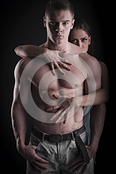 muscular naked man and female hands