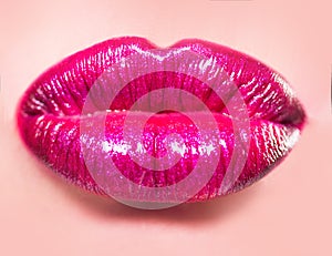 Sexy pink lips. Hot lipstick cosmetics. Full lips on woman face. Luxury icon. Beautiful girl close up. Hyaluronic acid