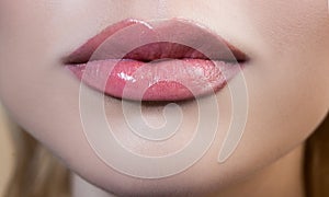 Sexy plump lips. Close-up female mouth. Perfect natural lip makeup. Close up part of beautiful woman face. Isolated lips