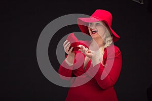 plus size woman in red hat with red lips.