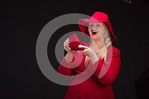 plus size woman in red hat with red lips.