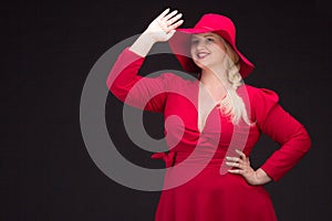 plus size woman in red hat with red lips.