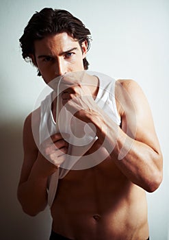 Sexy, portrait of young man in a studio with underwear for strong, body building and hot muscles. Serious, attractive