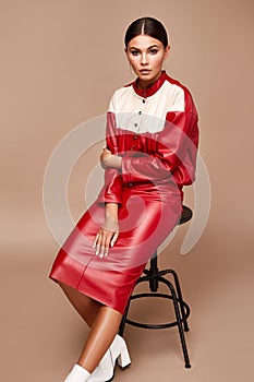Sexy pretty fashion woman wear lather red suit skirt jacket casual trend clothes collection catalogue style model pose bright make