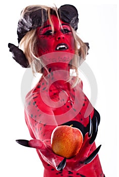 red devil woman holding an apple
