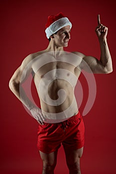 Sexy santa claus has idea. muscular and athletic guy. romantic christmas. love date at xmas. winter holiday desire photo