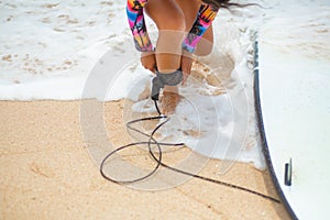 Sexy slim girl with surf board on tropical sand beach. Healthy active lifestyle in summer vocation