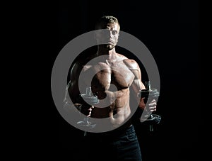 Sexy sporty torso, man with dumbbells. Muscular and strong guy exercising. Sportsman doing exercises with weights