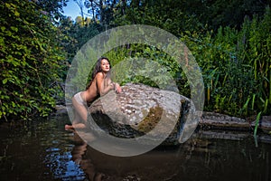 topless woman in the river