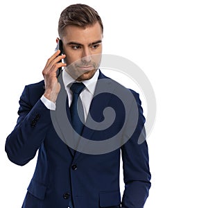 sexy unshaved businessman talking on the phone