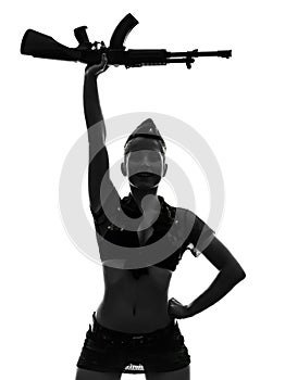 woman in army uniform saluting kalachnikov silhouette