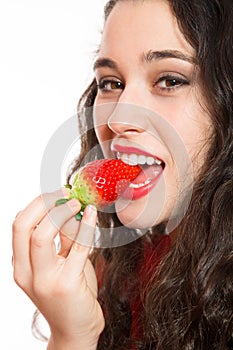 woman biting a strawberry