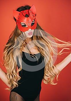 Sexy woman in cat mask. Beautiful brunette with long hair and sensual big lips - party  carnival  masquerade concept.