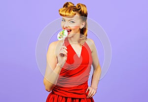 Sexy woman eating lollipop. Beautiful girl with fashion hairstyle eat Sweet candy.