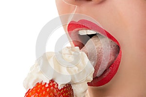 woman eating strawberry with cream, sensual red lips