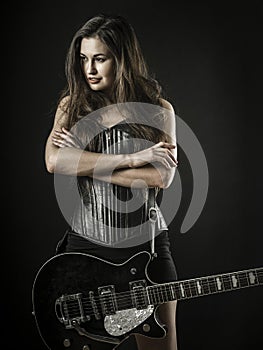 Sexy woman with electric guitar