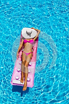 woman on a float in the pool