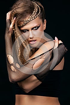 woman with haircut and art makeup is dancing disco 80 style. Vogue close-up portrait of beautiful girl