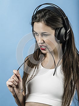 Sexy woman listening to music with headphones