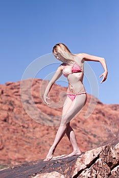 woman posing on red rocks
