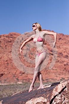 woman posing on red rocks