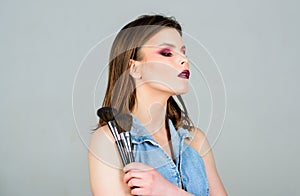 Sexy woman with professional make up brush. sexuality. skincare cosmetics. fashion makeup visage. woman with long hair