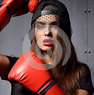 woman with red Boxing Gloves at the gym concept about sport