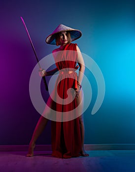 sexy woman in a red cape and an Asian hat with a katana in her hand image of a samurai in neon color