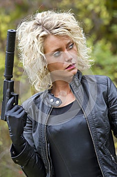 Woman with silencer gun photo