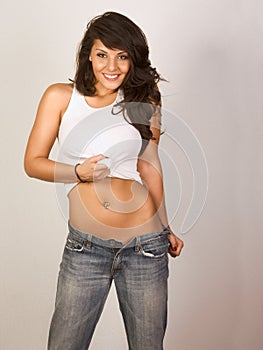 woman in unbuttoned jeans and tank-top photo