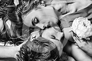 Sexy young couple in love. Portrait of intimate passionate sensual people. Kiss each other, enjoying tenderness. photo