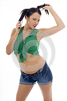 Young Pin Up Model Wearing a Green Tied Top And Blue Shorts