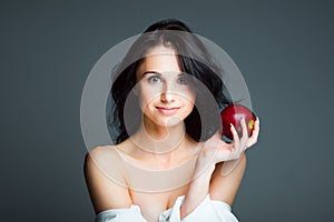 young woman with fresh red apple