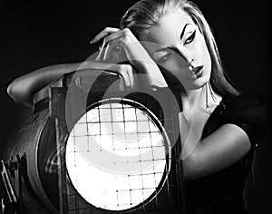 young woman with old floodlight photo