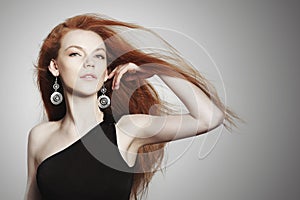 young woman with scatter red hair photo