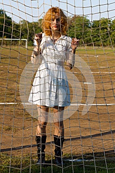 young woman at soccer gates